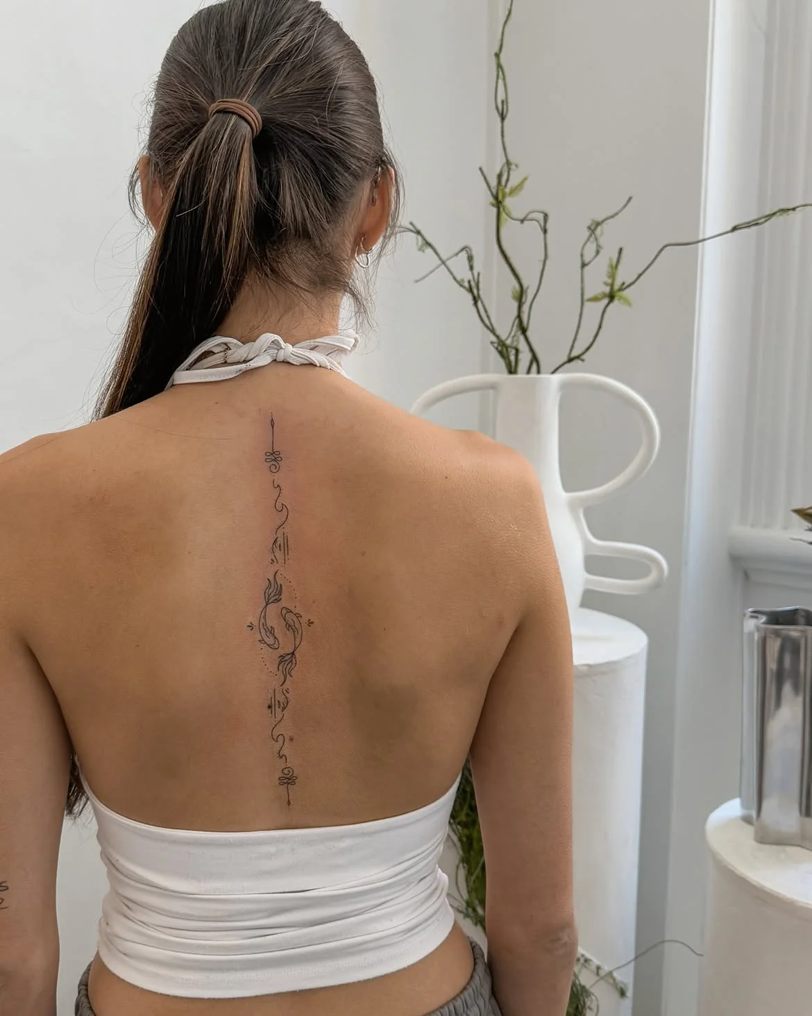 12 Spine Tattoo Ideas That Flow With Your Body’s Natural Lines